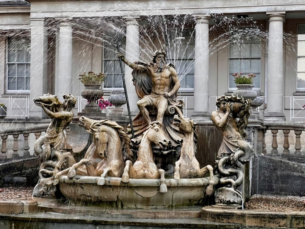 Neptune's Fountain with sea horses on the Promenade in Cheltenham