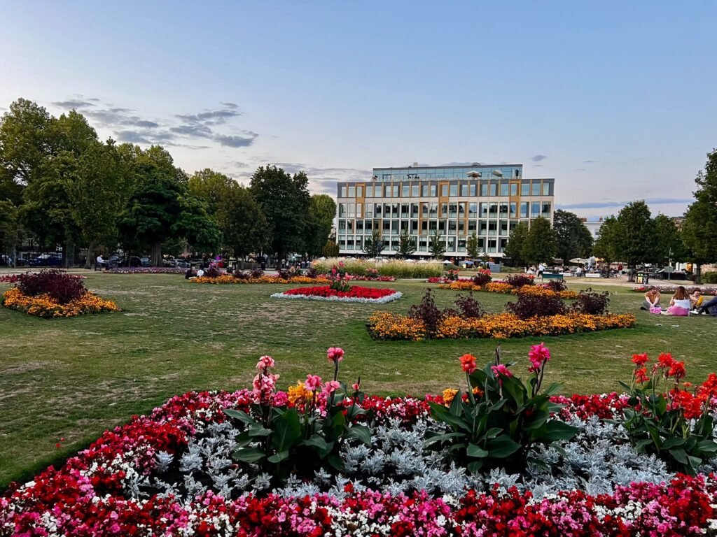 Things to do in Cheltenham – walking across Formal flower beds in Imperial Gardens in Cheltenham