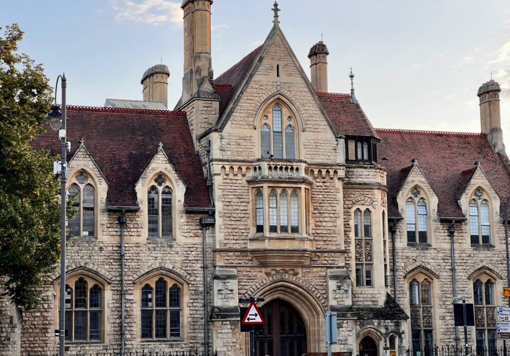 Ornate historic stone building with balconies in Cheltenham