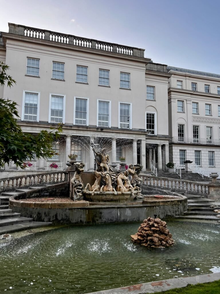 Neptune’s Fountain with Regency buildings behind it in Cheltenham