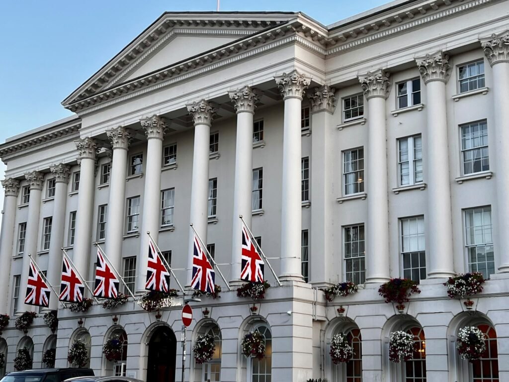 Queens Hotel on the Promenade in Cheltenham with Union flags