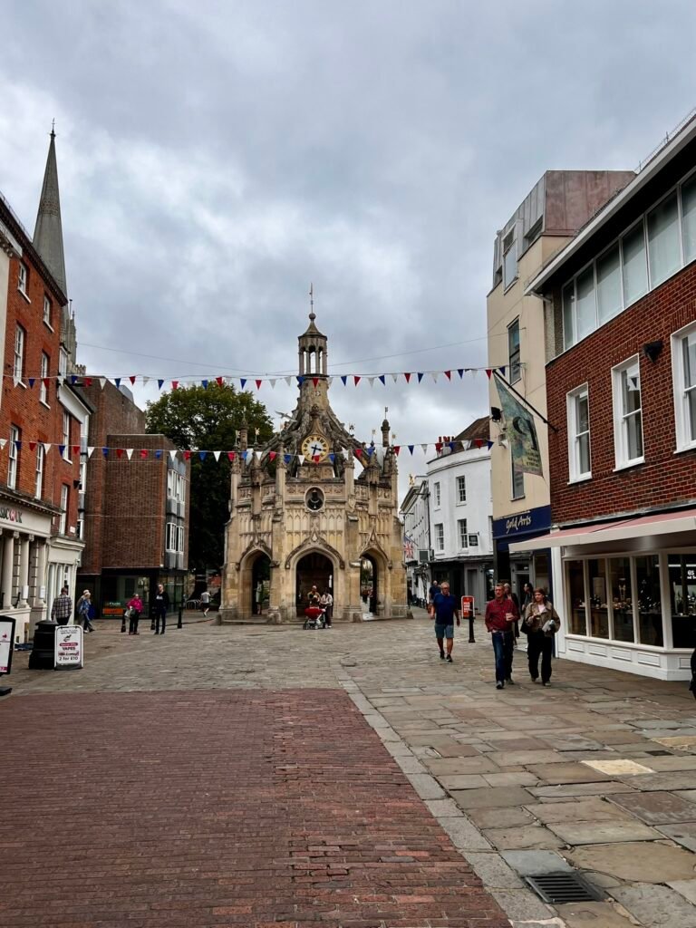 Chichester Cross surrounded by pedestrians in Chichester city centre