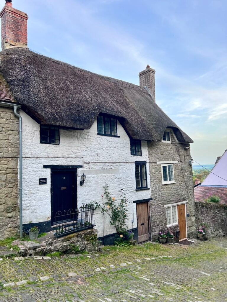 Historic thatched cottage beside Gold Hill in Shaftesbury Dorset