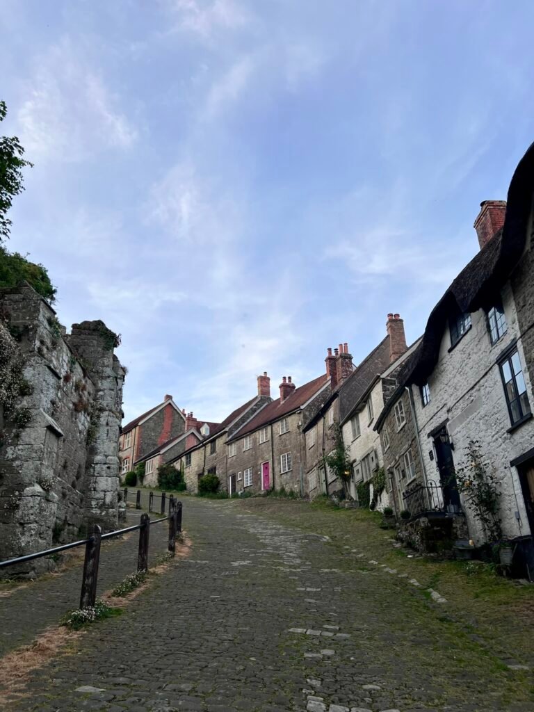 Looking uphill along Gold Hill Shaftesbury past historic stone cottages