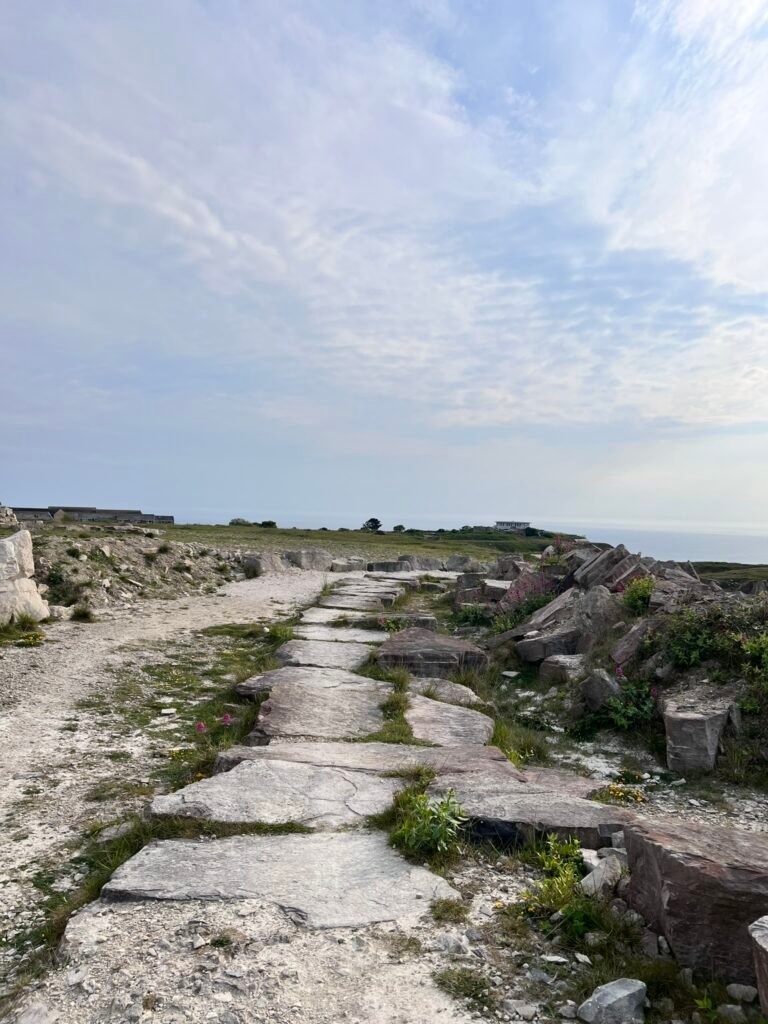 Stone path and blocks of Portland limestone on the walk towards Portland Bill