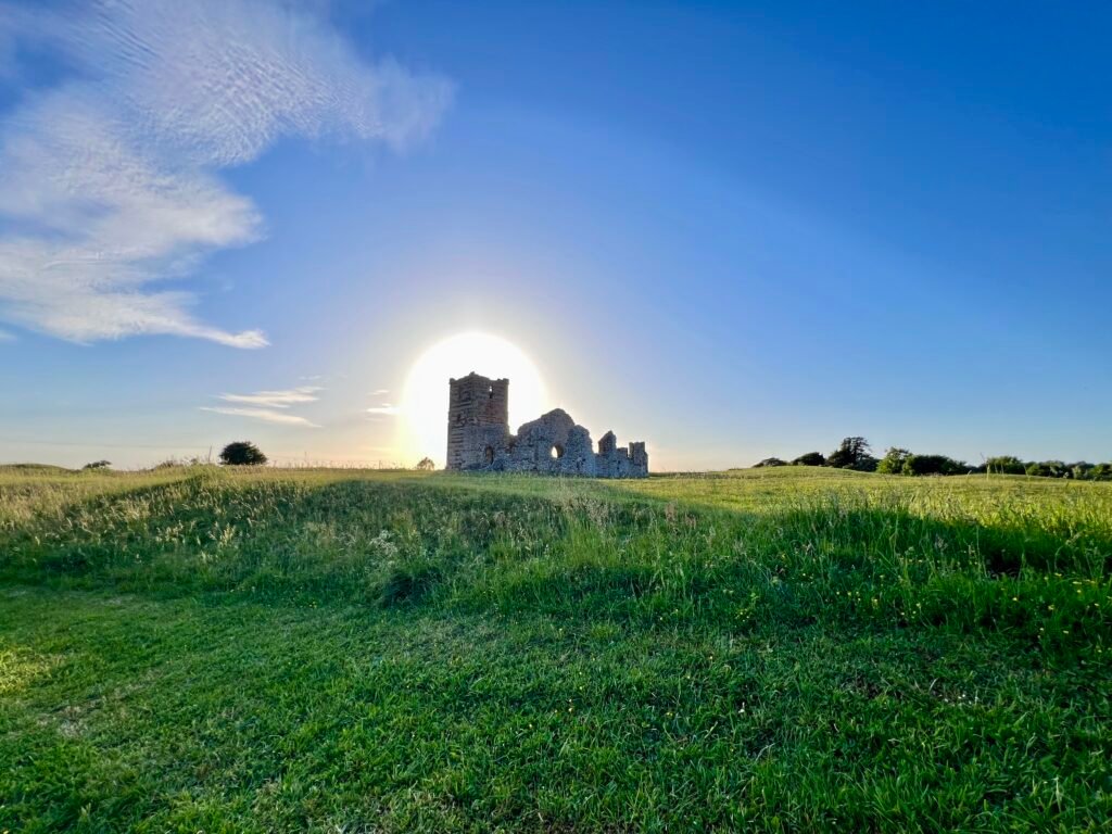 Ruins of Knowlton Church in Dorset at sunset, cared for by English Heritage