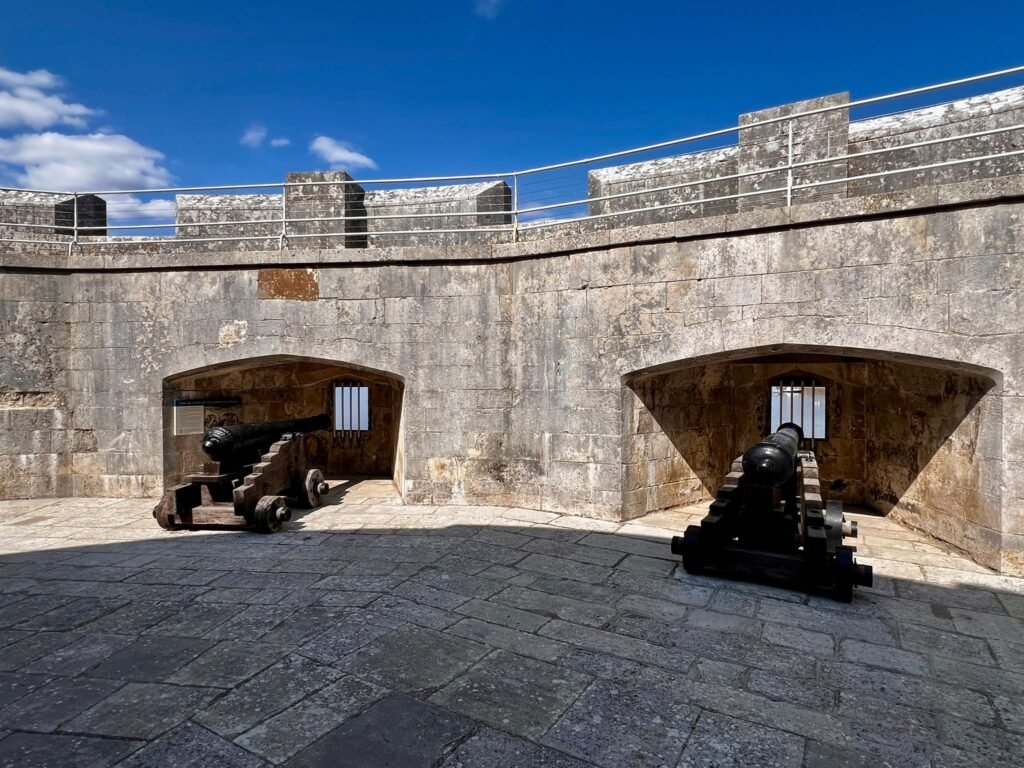 Two historic cannons positioned inside Portland Castle’s gun battery