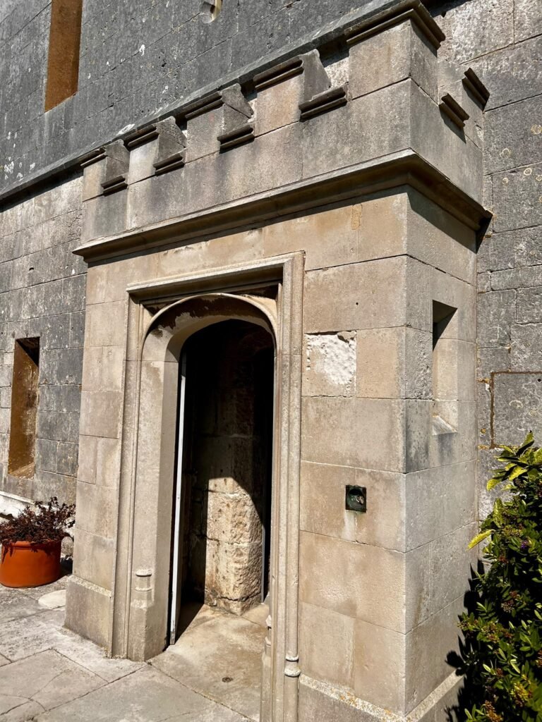 Historic stone doorway leading into Portland Castle