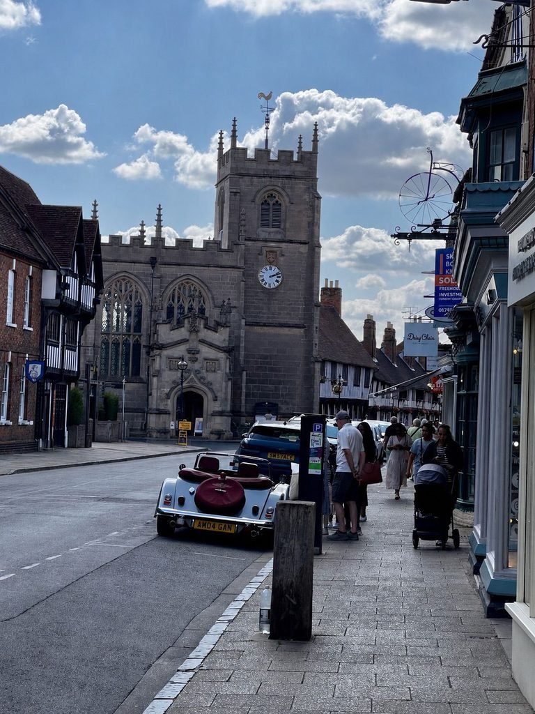 Busy historic street in Stratford-upon-Avon with timber-framed buildings