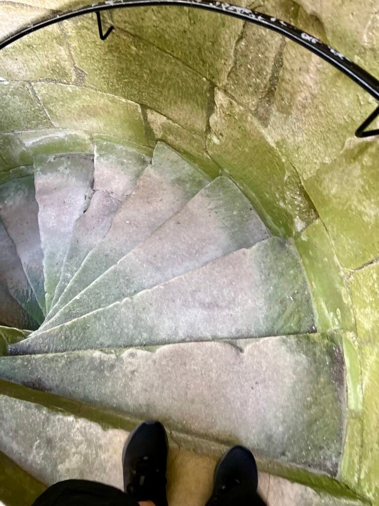 Worn stone spiral staircase inside Old Wardour Castle