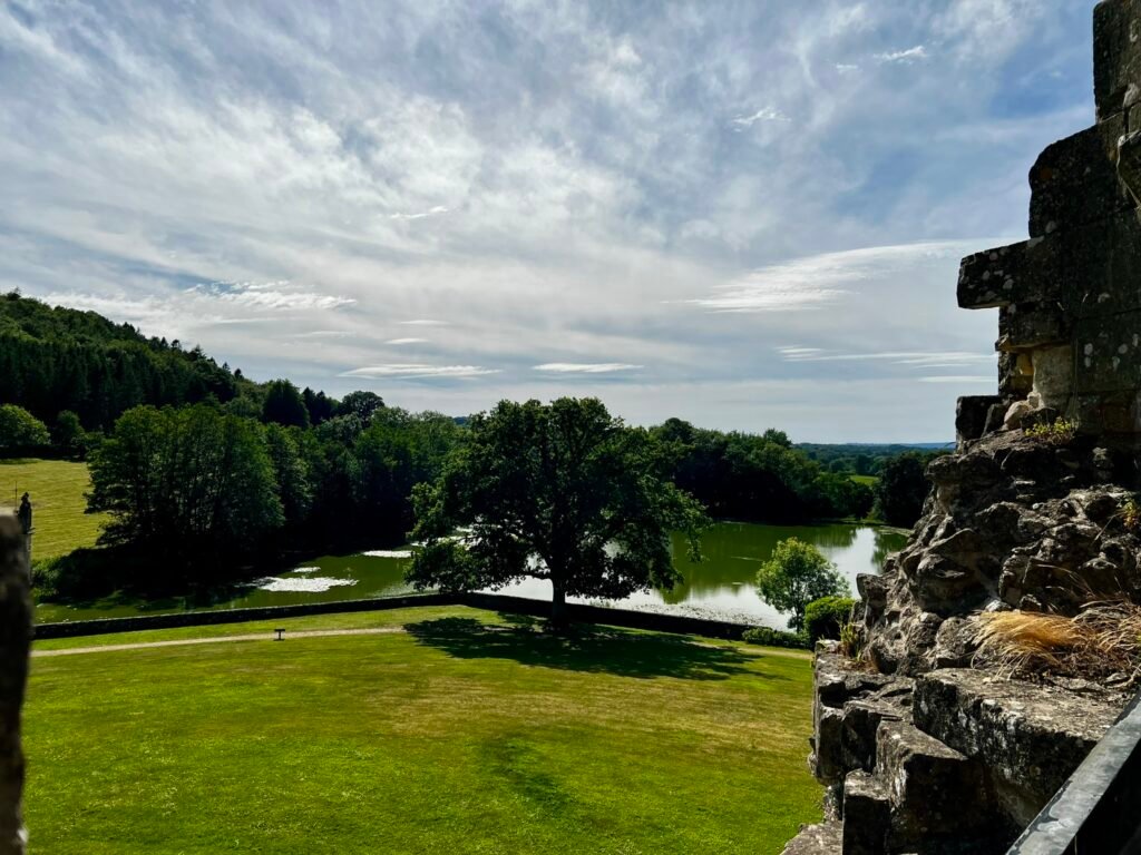 Lake, lawns and wooded countryside seen from Old Wardour Castle