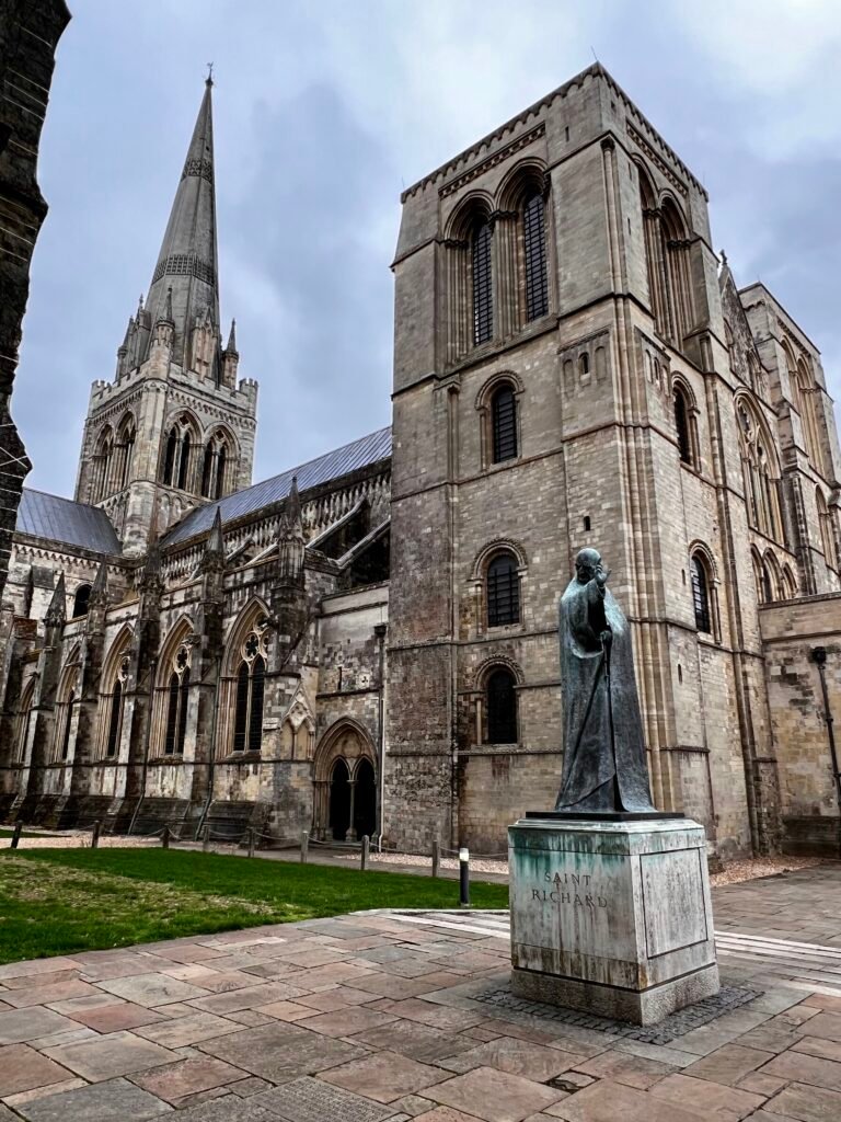 Statue of St Richard with Chichester Cathedral and its spire behind