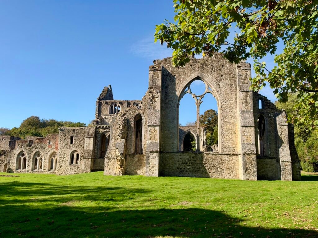 Gothic window arches and medieval stone ruins at Netley Abbey in Hampshire