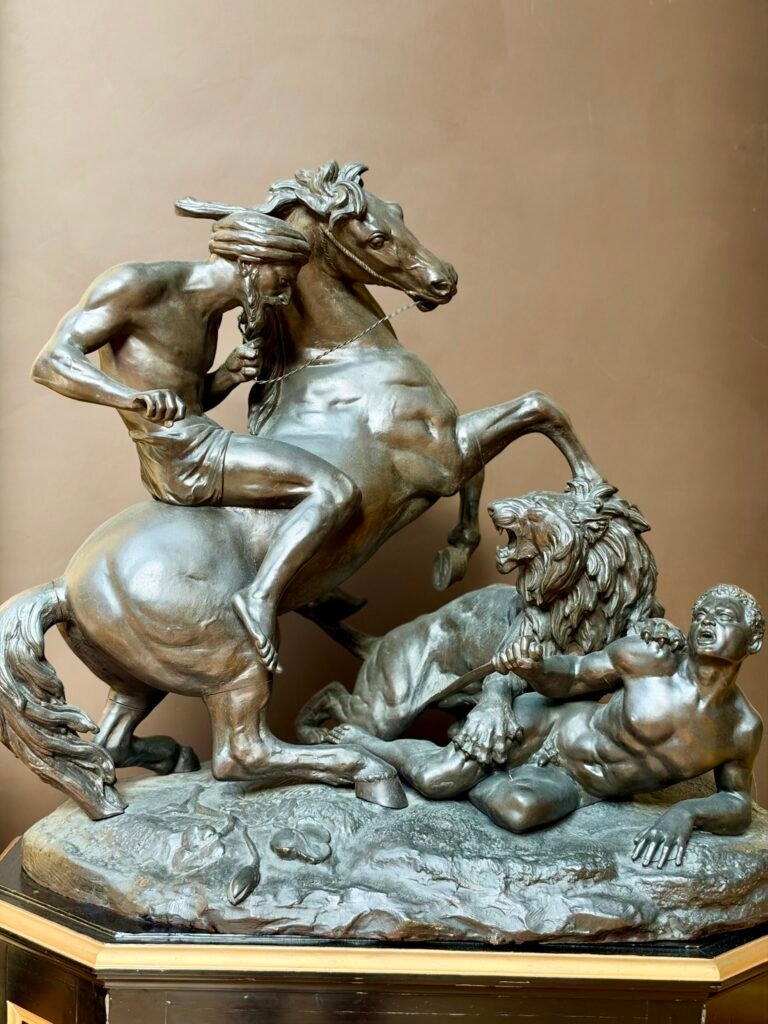 Aimé Millet's bronze Lion Hunt showing a horseman, lion and injured man at Russell-Cotes Art Gallery