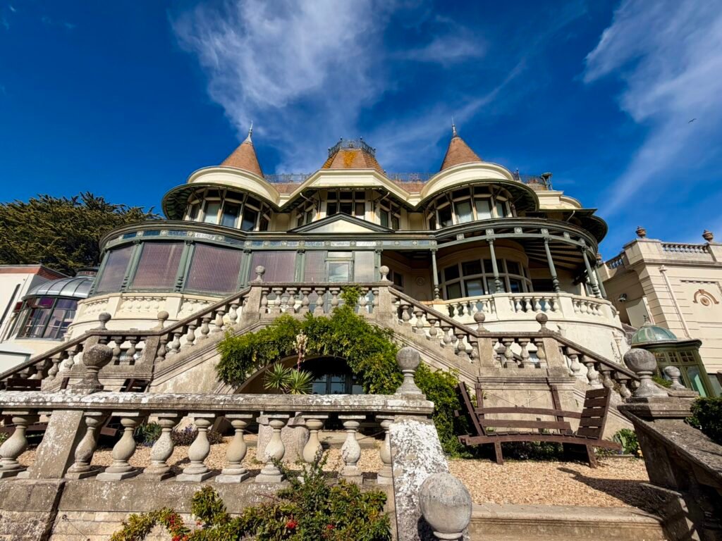 Garden-facing facade and broad stone staircases of the Russell-Cotes Victorian house in Bournemouth