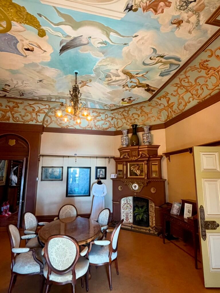 Morning Room with painted Greek gods, winged figures and Pegasus on the ceiling at Russell-Cotes Museum