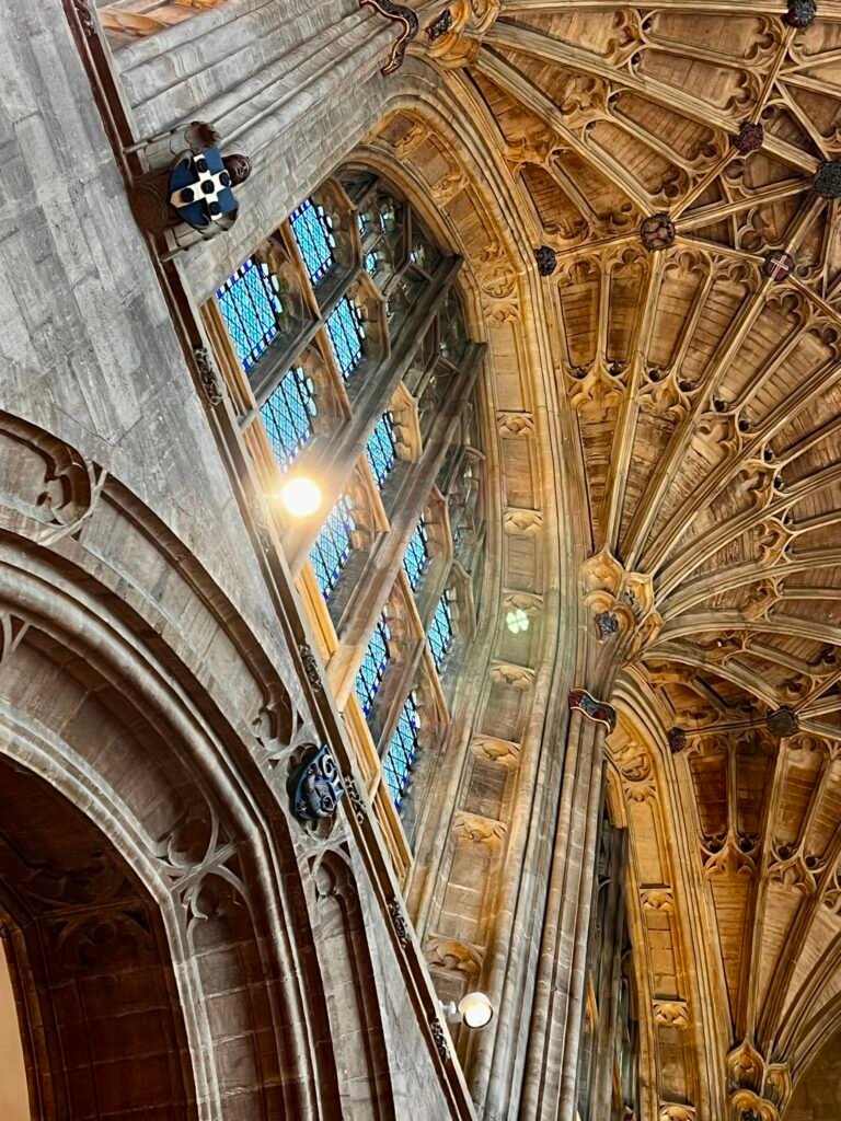 Detailed fan-vaulted ceiling and clerestory windows inside Sherborne Abbey
