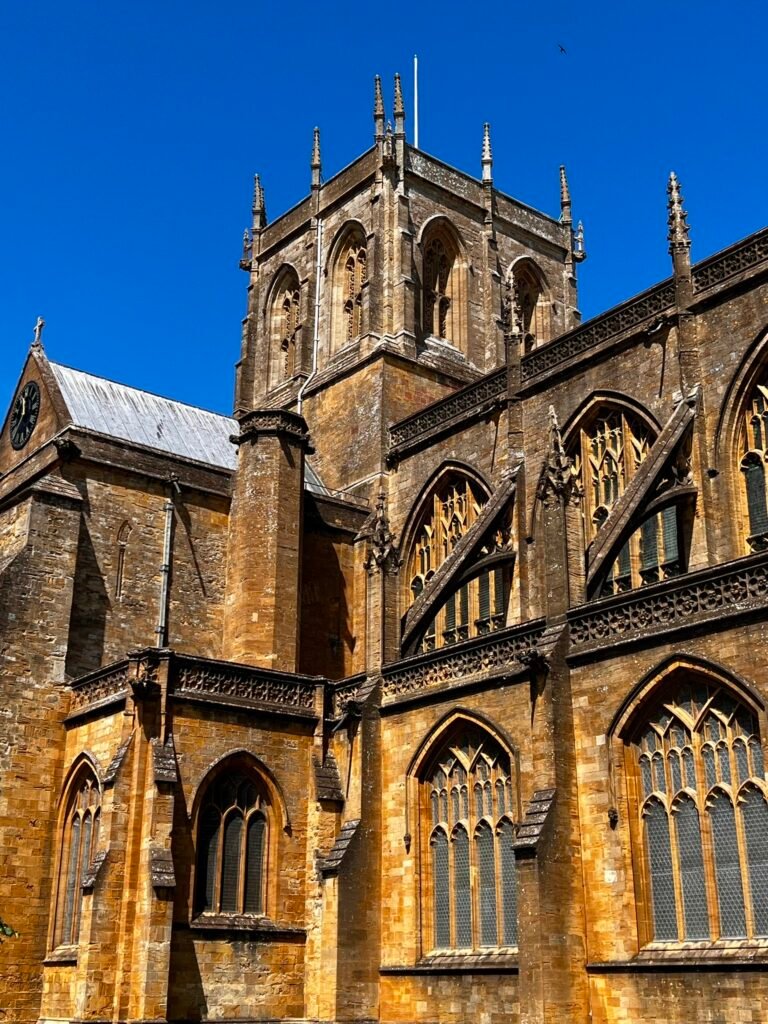 Medieval tower and Gothic windows of Sherborne Abbey in Dorset