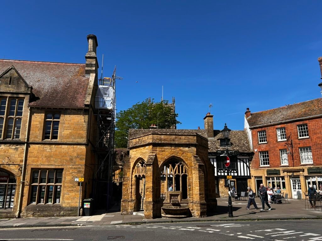 The Conduit in Sherborne Dorset town centre on Cheap Street under a blue sky