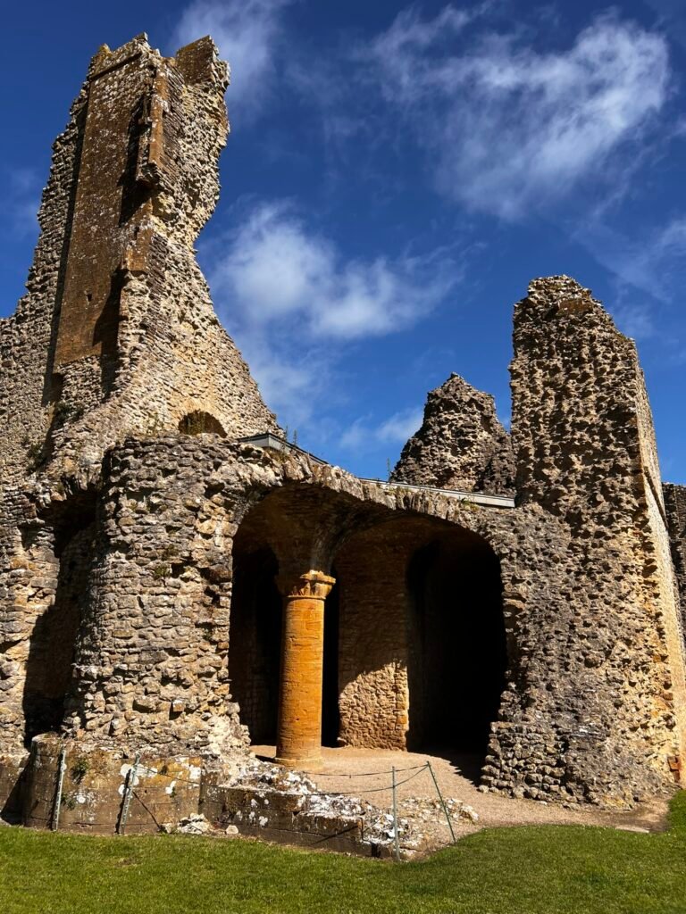 Stone column and arched ruins inside Sherborne Old Castle