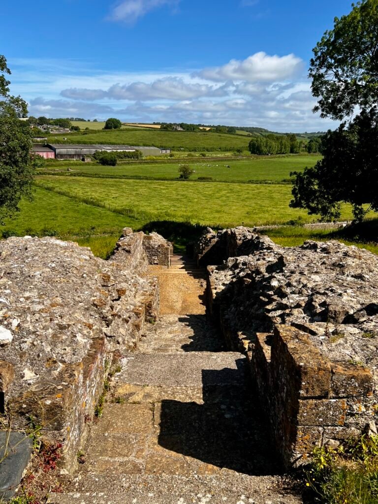 View down castle steps towards the Dorset countryside from Sherborne Old Castle
