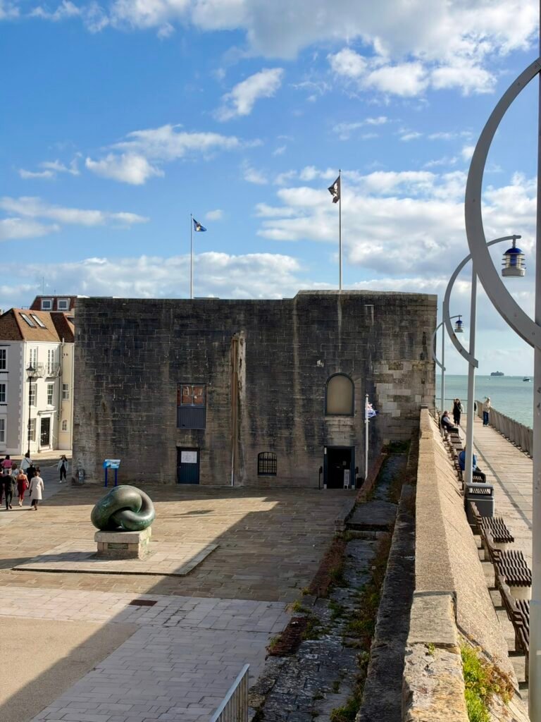Square Tower and bronze sculpture beside the waterfront promenade in Old Portsmouth
