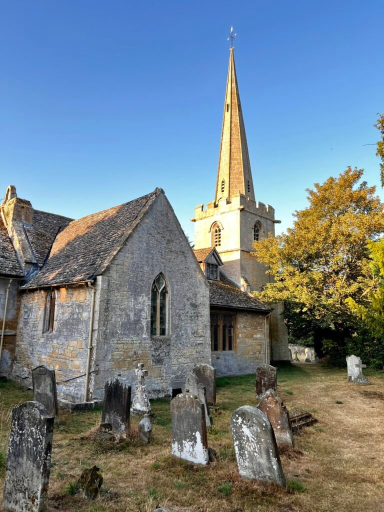 St Michael and All Angels' Church and old gravestones in Stanton, Gloucestershire