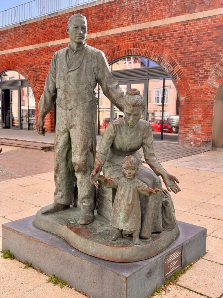 The Crossing bronze statue showing an emigrant family in Old Portsmouth