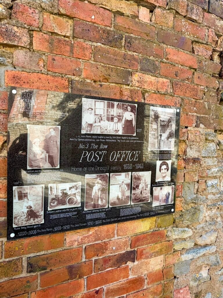 Historical photographs of Tyneham Post Office and the Driscoll family on an old brick wall