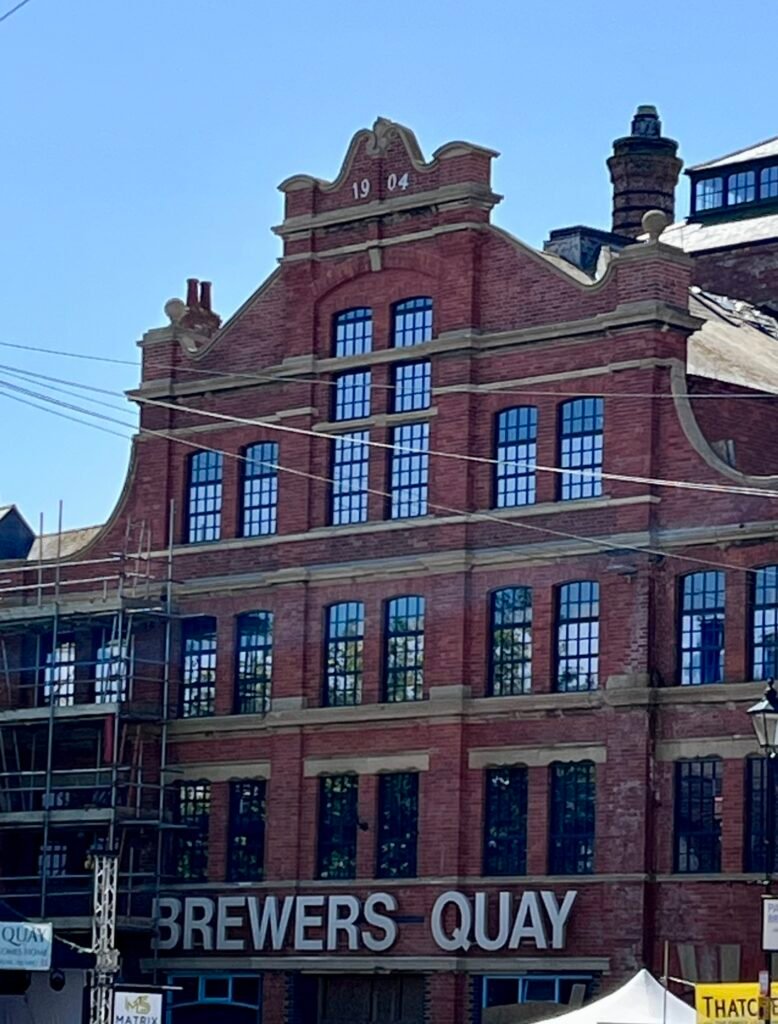 Historic Brewers Quay red-brick building in Weymouth dated 1904