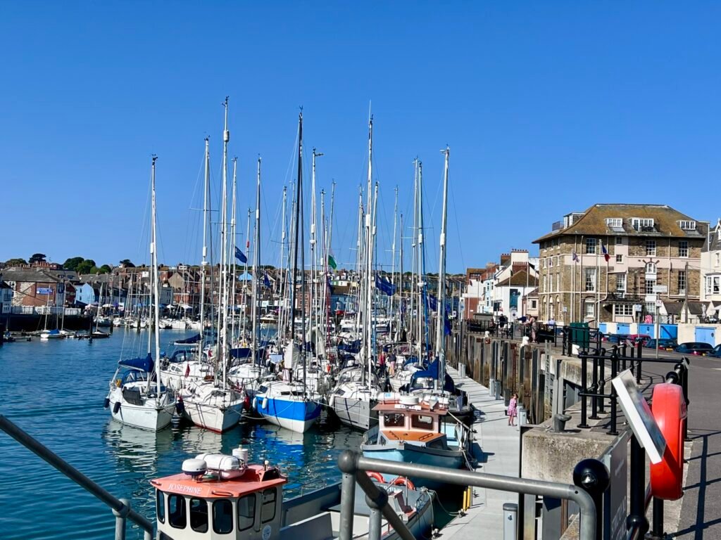 Sailing boats and yachts packed into Weymouth Harbour, Dorset