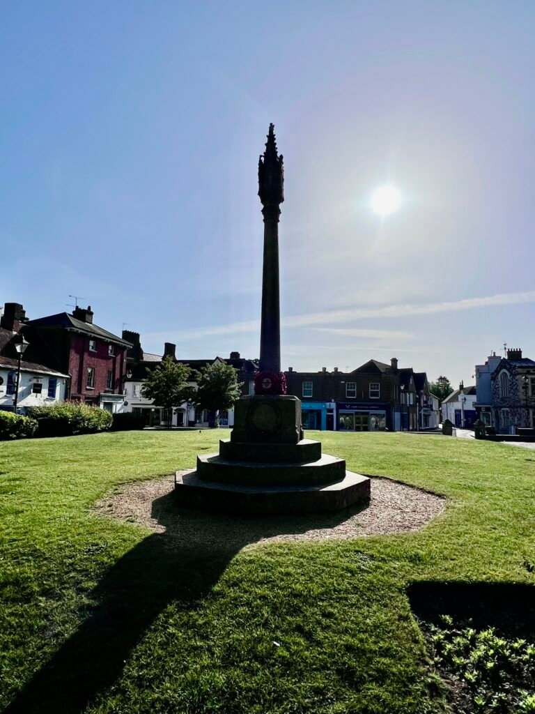 Minster Green and war memorial beside Wimborne Minster in Dorset