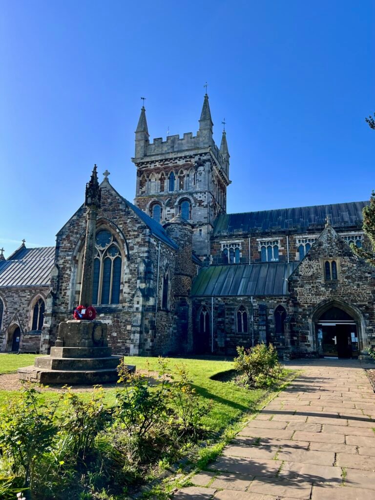 Wimborne Minster historic church under a blue sky in Dorset